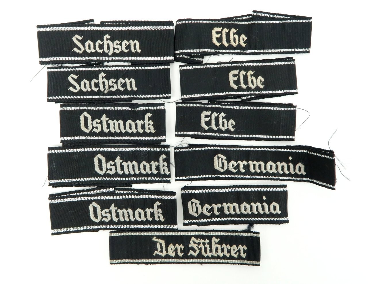 Lot of Assorted Reproduction SS Cuff Titles (MM911)