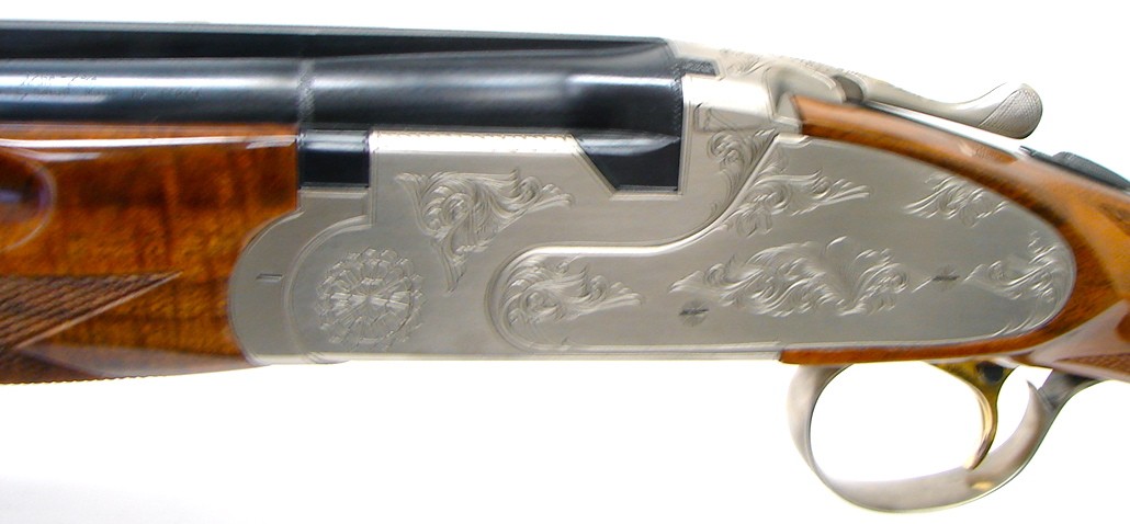 Weatherby Athena 12 gauge shotgun. Over/under gun with 32